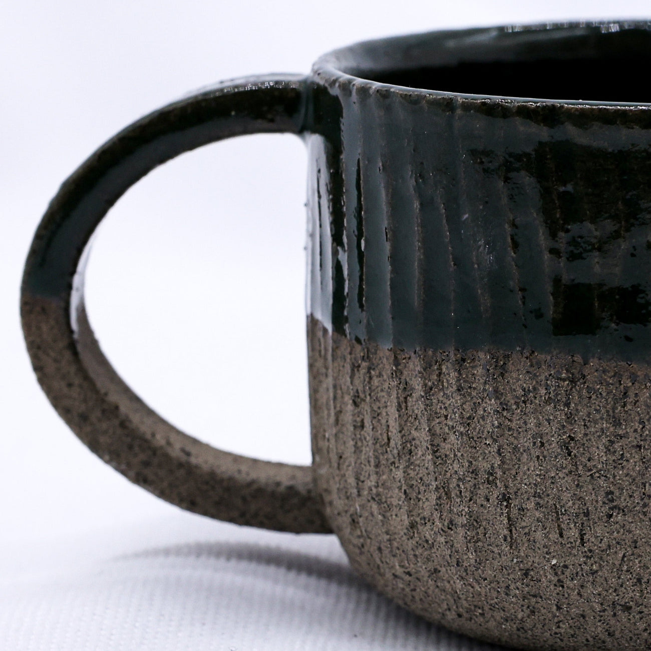 Grey ceramic mug on a white background