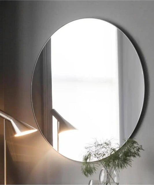 Round Simplistic Mirror with a large circular design for a spacious feel