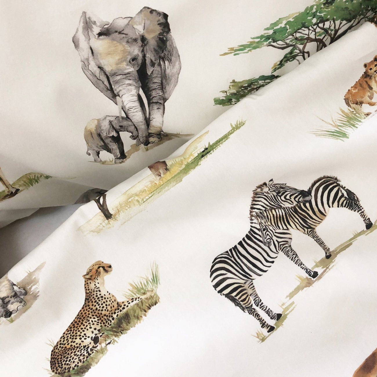 Sheet set with safari animal print on a white background
