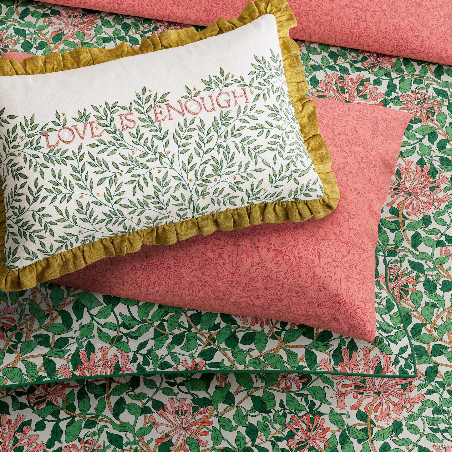 William Morris Love is Enough cushion evergreen on chair