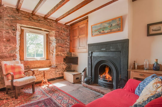 Relaxing by this roaring fire is one of our favourite things to do in the Lake District... check out the home tour of our cosy cottage. Photo credit to Stewart Smith Photography: www.stewartsmithphotography.co.uk