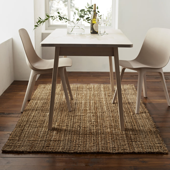 House of Flora jute rug under table