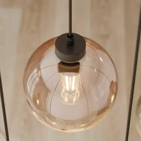 Warm-toned glass pendant light, perfect for modern and rustic decor