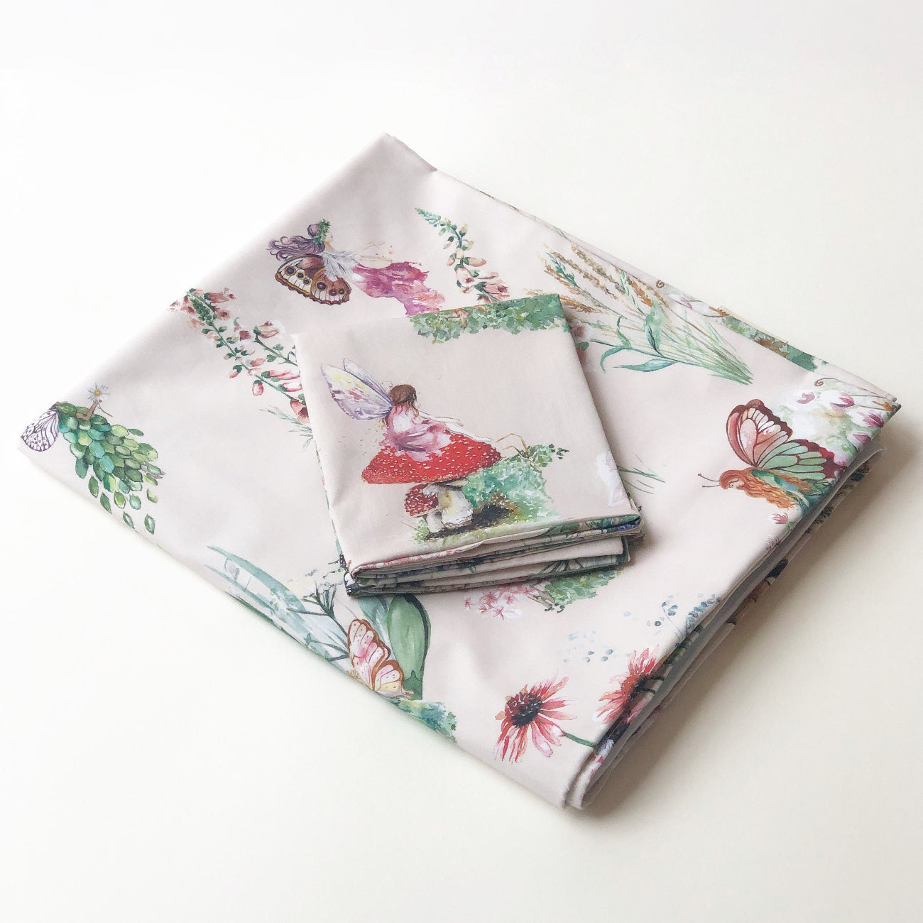 Floral and fairy-themed fabric on a white background