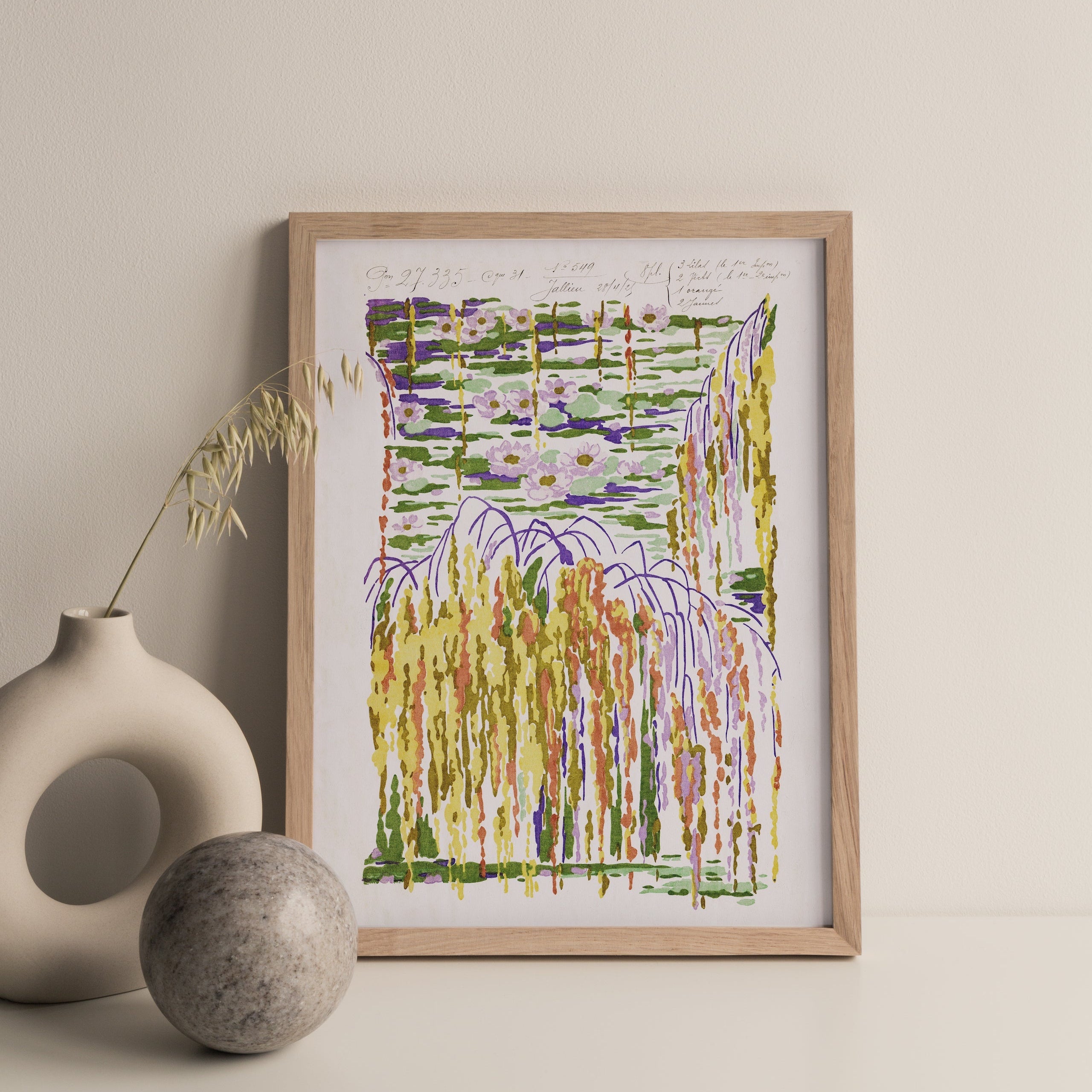 Framed abstract artwork on a beige wall with decorative vases.