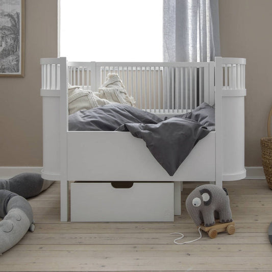 White wooden baby cot bed